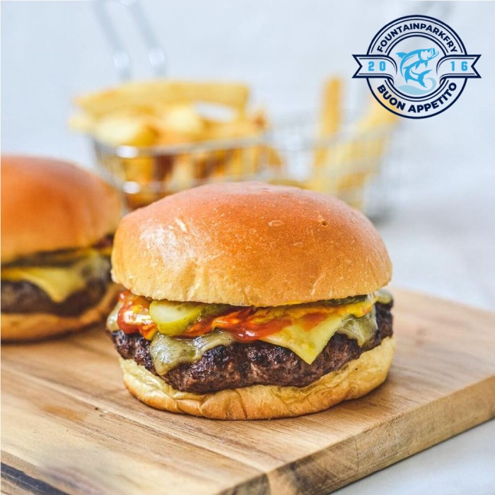 Two Gourmet Burgers Served on a Plate at Fountain Park Fry Edinburgh 